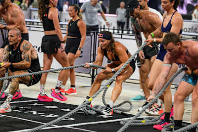 Laura Horváth and Kristof Horváth of Hungary tackle the rope-pull challenge during the HYROX World Championship Double Mix races in Stockholm, Sweden.