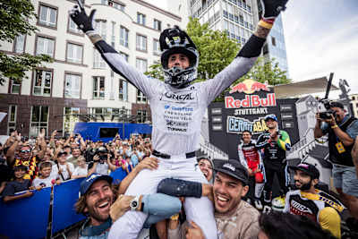 Alex Marin is lifted by supporters after celebrating victory at Red Bull Stuttgart Cerro Abajo in Stuttgart, Germany. 