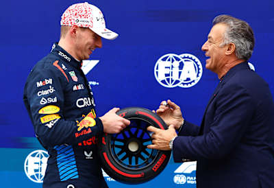 Pole position qualifier Max Verstappen is presented with the Pirelli Pole Position trophy by Jean Alesi in parc ferme during qualifying ahead of the F1 Grand Prix of Japan on April 06, 2024  