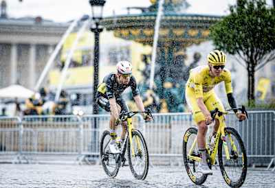 Wout van Aert and Yellow Jersey / GC leader Tadej Pogačar race at stage 21 during the 112th Tour de France 2025 on July 27.
