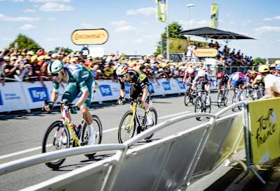 Jonathan Milan sprints past Wout van Aert to win Stage 8 of the 2025 Tour de France in Laval.