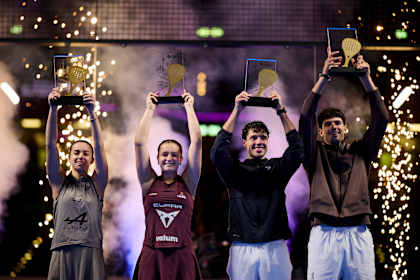 Claudia Fernández Sánchez, Martina Calvo Santamaría, Agustín Tapia and Arturo Coello lift their trophies at the 2026 Premier Padel P2 Düsseldorf ceremony at Esprit Arena.