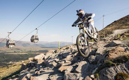 Vali Höll on bike during UCI DH World Cup 2024 in Fort William, Scotland
