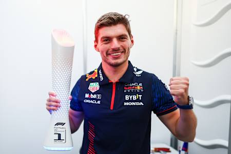 Race winner Max Verstappen of the Netherlands and Oracle Red Bull Racing poses with the trophy in Suzuka, Japan.
