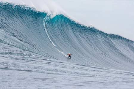 Justine Dupont riding a huge wave at Cortes Bank, off the coast of California, USA.