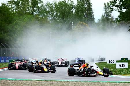 Max Verstappen leads Sergio Perez and the rest of the field into turn one at the start during the F1 Grand Prix of Emilia Romagna at Autodromo Enzo e Dino Ferrari on April 24, 2022.