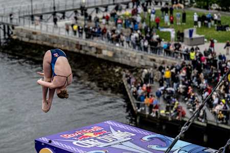 Molly Carlson of Canada dives from the 21m platform during the final competition day of the first stop of the Red Bull Cliff Diving World Series in Boston, USA, on June 3, 2023. 