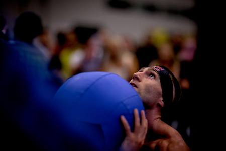 HYROX competitor Jake Dearden performing wall balls. 