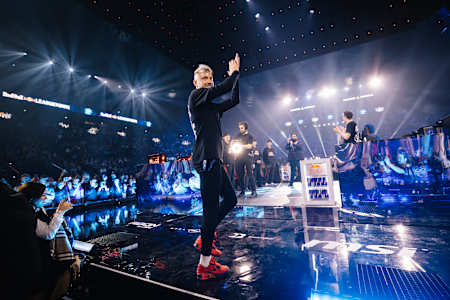 In 2024, Rekkles waves to fans at Red Bull League of Its Own esports event in Paris.