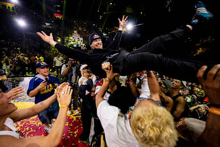 B-boy Menno of the Netherlands is lifted aloft while celebrating his win during the Red Bull BC One World Final at Farmasi Arena, Rio de Janeiro, Brazil on December 7, 2024.