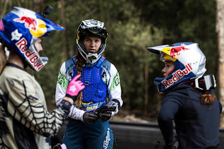 Tahnée Seagrave, Louise Ferguson and Gracey Hemstreet discuss the course during  practice at Red Bull Hardline  in Maydena Bike Park,  Australia on February 21,  2024