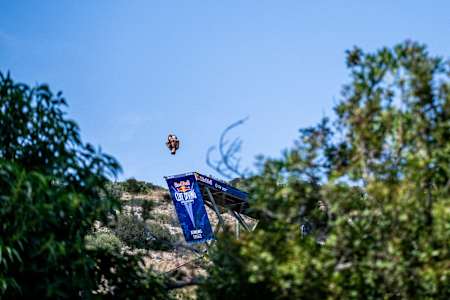 Aidan Heslop of the UK dives from the 27 metre platform during the first stop of the 2024 Red Bull Cliff Diving World Series at Lake Vouliagmeni in Athens, Greece on May 25, 2024.