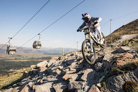 Vali Höll on bike during UCI DH World Cup 2024 in Fort William, Scotland