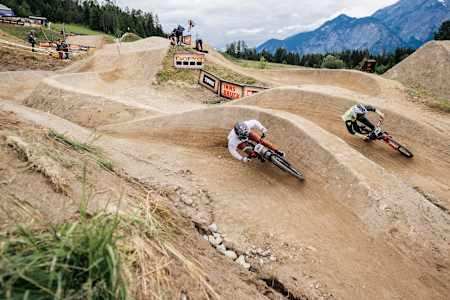 Competitors perform during Dual Slalom at Crankworx in Innsbruck, Austria on June 15, 2024