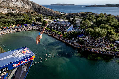 Constantin Popovici of Romania dives during the 2024 Red Bull Cliff Diving World Series at Lake Vouliagmeni in Athens, Greece on May 26, 2024. 
