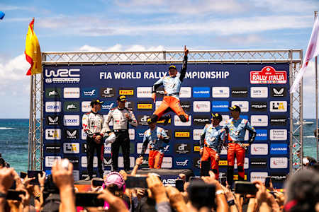 Ott Tänak (EST) and Martin Järveoja (EST) Of team HYUNDAI SHELL MOBIS WORLD RALLY TEAM celebrate on the podium after winning World Rally Championship in Alghero, Italy on 02.06.2024 