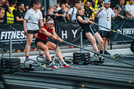 HYROX athlete Ida Mathilde Steensgaard working hard at the sled push station 