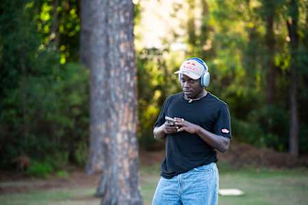 In 2023, Zion Wright listens to music at the Red Bull Drop In Tour in Australia.
