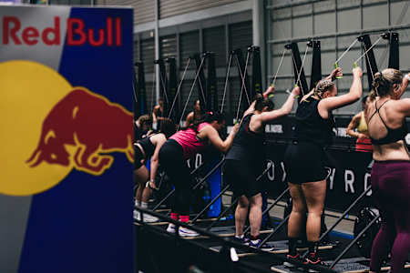 Hyrox competitors use the ski ergs next to the Red Bull hydration station at Hyrox's Sydney event on July 27, 2024.