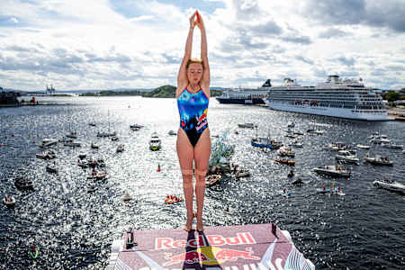 Molly Carlson of Canada prepares to dive during theRed Bull Cliff Diving World Series at the Oslo Opera House, Oslo, Norway on August 10, 2024. 