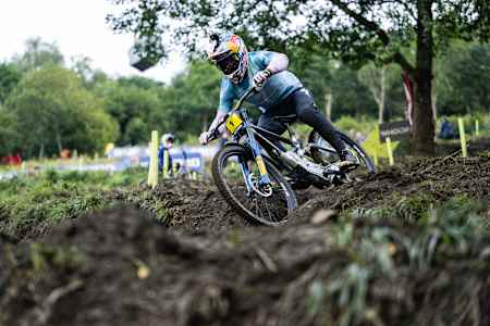 In 2024, Loïc Bruni races downhill at UCI World Cup event.