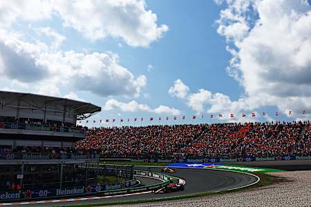 Max Verstappen leads Lando Norris during the F1 Grand Prix of Netherlands at Circuit Zandvoort on August 25, 2024.