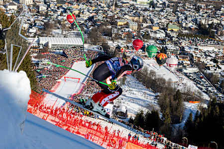 James Crawford soars through the air during the downhill race in Kitzbühel, Austria, in the 2024-2025 season