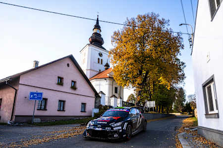 Elfyn Evans and Scott Martin of Toyota Gazoo Racing WRT tackle the streets of Passau, Germany, during the World Rally Championship CER on October 18, 2025, flying past iconic local landmarks.