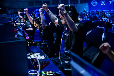 ZETA DIVISION gamers triumphantly raise their arms in victory at the Red Bull Home Ground APAC Qualifier, Tokyo, Japan, on October 20, 2024.