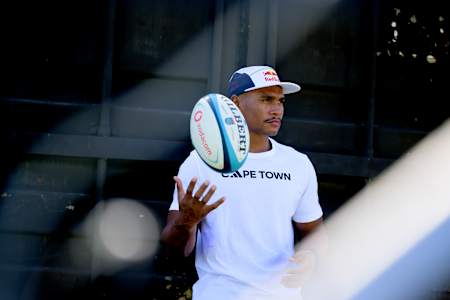 Damian Willemse sports a Red Bull cap and Cape Town tee during 2024 rugby training in South Africa.