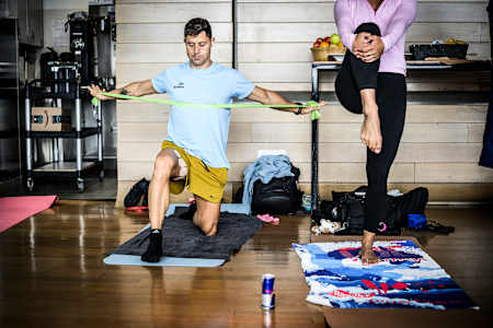 Constantin Popovici of Romania stretches at the athletes' area during the training day of the final stop of the Red Bull Cliff Diving World Series in Boston, USA, on September 18, 2025. 