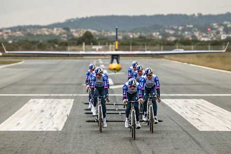 On December 4, 2026, the Red Bull - BORA - hansgrohe cycling team sprints down the runway during the Peloton Take Off event in Palma de Mallorca, Spain, blending adrenaline and precision