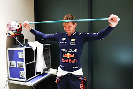 Max Verstappen of Oracle Red Bull Racing stretches before a F1 Grand Prix 