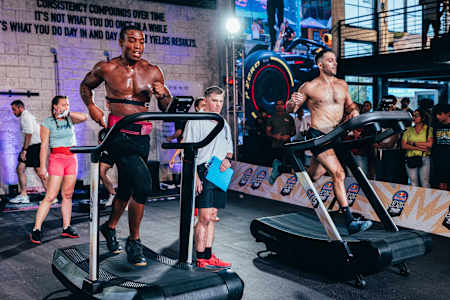 Two men run on a treadmill at Red Bull Gym Clash