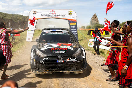 Kalle Rovanpera and Jonne Halttunen celebrate on the podium in first place after winning the World Rally Championship Safari Rally in Naivasha, Kenya on March 31, 2024
