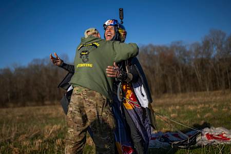 Chilean wingsuit flier Sebastián Álvarez gets a hug after successfully breaking theee world records during his Red Bull Starman Mission project.