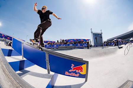 Jamie Foy nails a backside tailslide at the 2024 Red Bull Drop In in Santiago, Chile, under a sunny sky.