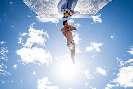 Aidan Heslop performs a breathtaking dive from a 27m platform at the 2024 Red Bull Cliff Diving World Series, Oslo, Norway.