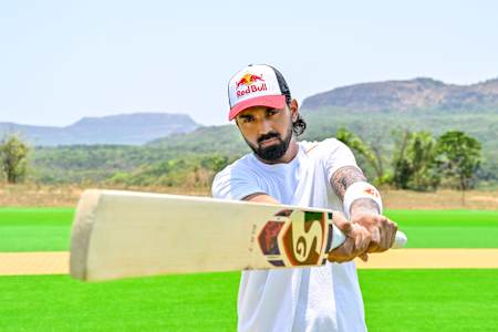 India's cricket star KL Rahul gears up with his bat during Red Bull Cricket Challenge 
