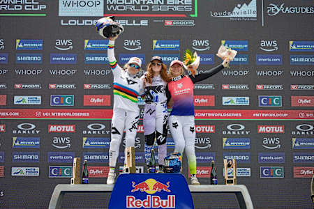 Gracey Hemstreet, Valentina Höll, and Tahnee Seagrave celebrate their podium at the UCI Mountain Bike World Cup 2025 in Loudenvielle-Peyragudes, France