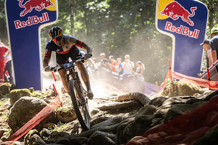 On June 20, 2025, Martín Vidaurre Kossmann rides through a challenging rocky section at the UCI Mountain Bike World Cup in Val di Sole, Italy.