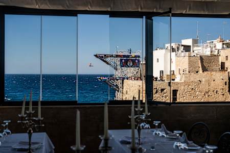 On 28 June 2025, Jonathan Paredes of Mexico dives from the 27 metre platform during the electrifying Red Bull Cliff Diving World Series stop in Polignano a Mare, Italy