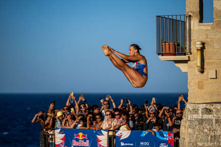 On June 28, 2025, Elisa Cosetti of Italy dives from the iconic 20 metre balcony at the Red Bull Cliff Diving World Series, soaring above crowds in Polignano a Mare, Italy