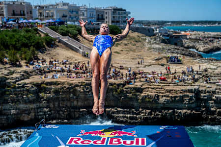 Lisa Faulkner of the USA soars from the 21 metre platform at the Red Bull Cliff Diving World Series 2025 in Polignano a Mare, Italy, capturing the thrill and adrenaline of the iconic event