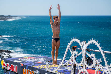 Andrea Barnaba of Italy stands poised on the 27-metre platform above the Adriatic during the thrilling final day of Red Bull Cliff Diving World Series 2025 in Polignano a Mare, Italy