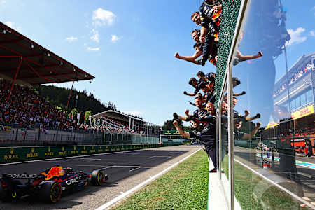 Race winner Max Verstappen passes his team celebrating on the pitwall during the F1 Grand Prix of Belgium at Circuit de Spa-Francorchamps on August 28, 2022 in Spa, Belgium. 