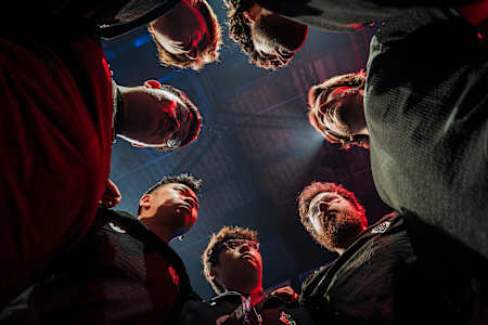 G2 Esports team gathers in an intense huddle before their match at Red Bull Home Ground 2024, Berlin, capturing the competitive spirit and unity on 22 November 2024