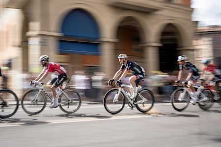 Nico DENZ of Red Bull-Bora-Hansgrohe sprints through Bologna, Italy during stage 2 of the 111th Tour de France 2024, capturing the adrenaline of world-class cycling