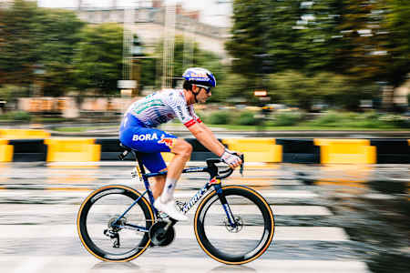 Red Bull - BORA - hansgrohe rider Mick van Dijke powers through the streets of Paris during Stage 21 of the 2025 Tour de France.