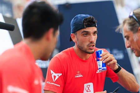 Alejandro Galán of Spain enjoys a Red Bull during the 2025 BNL Italy Major Premier Padel semi-final at Foro Italico in Rome.